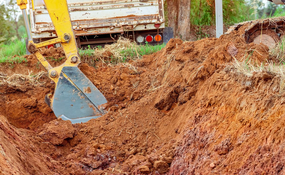 Excavator,Bucket,Digging,Soil,For,Loading,To,Truck.,Earthwork.,Dirt