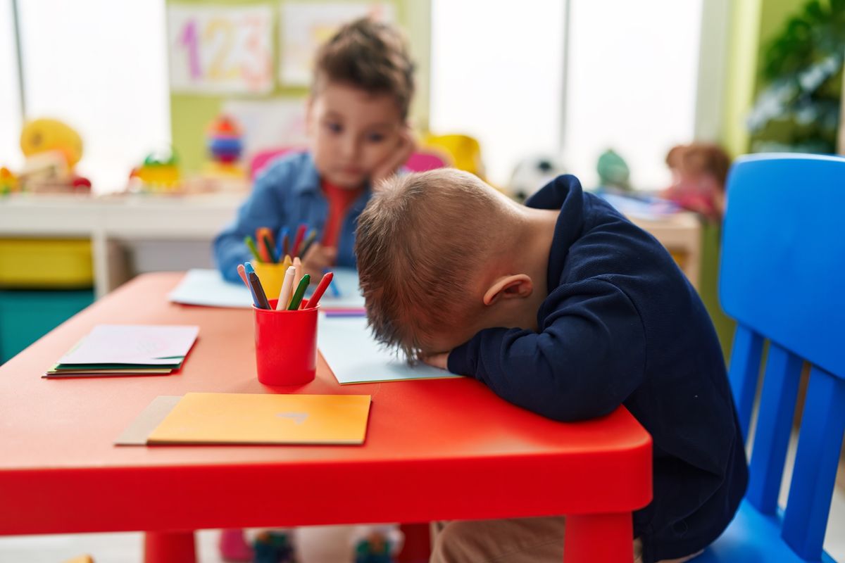 Adorable,Boys,Preschool,Students,Sitting,On,Table,Crying,At,Kindergarten