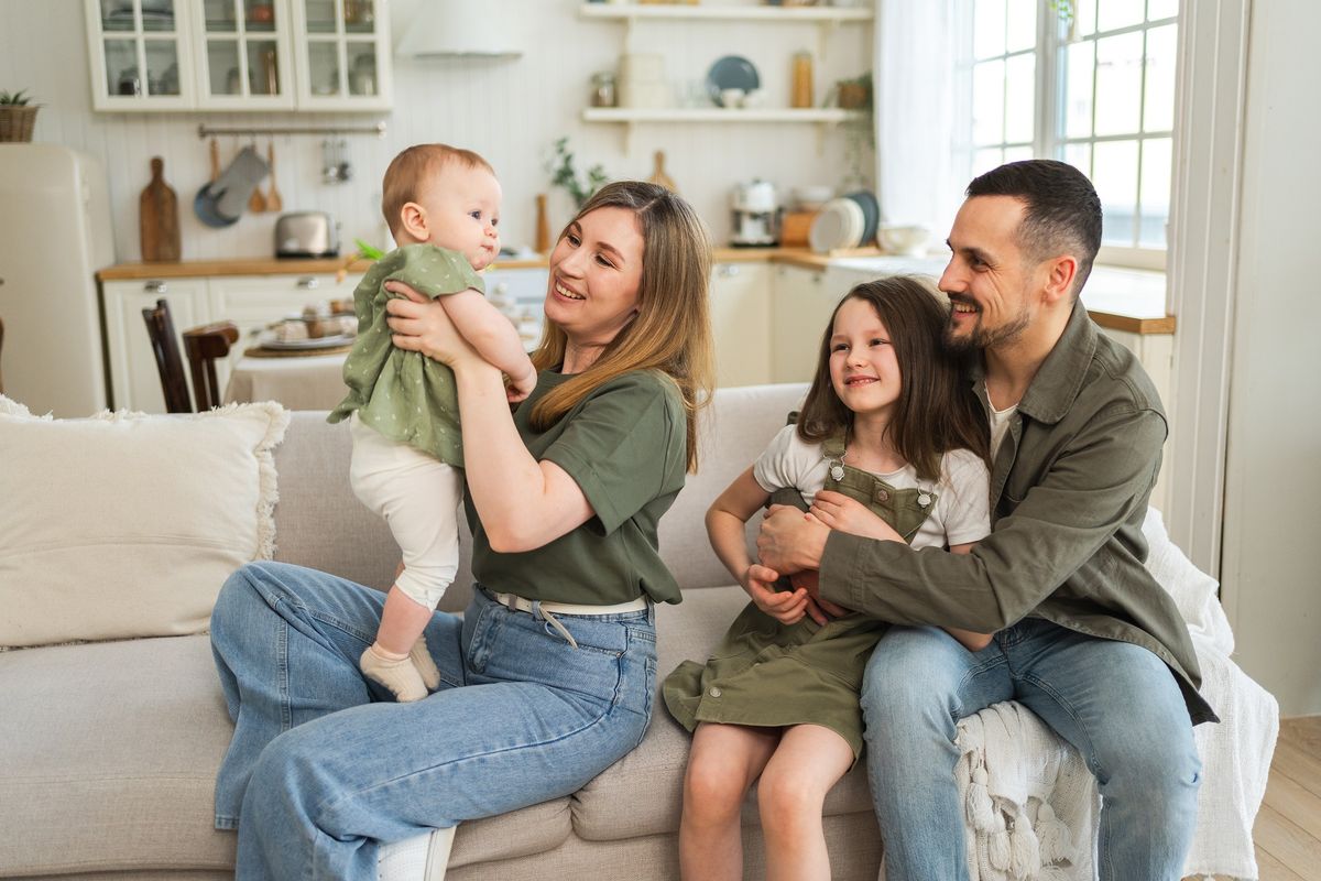 Happy,Family,At,Home.,Mother,Father,Two,Children,Daughters,Relaxing