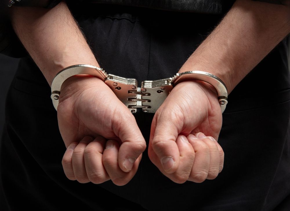 Hands,In,Handcuffs,Closeup,View.,Crime,,Arrest,And,Jail,Concept